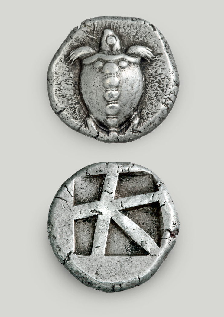 Two sides of the Aegina silver stater. On the obverse sea turtle, on the reverse incuse square split in 5 sections.