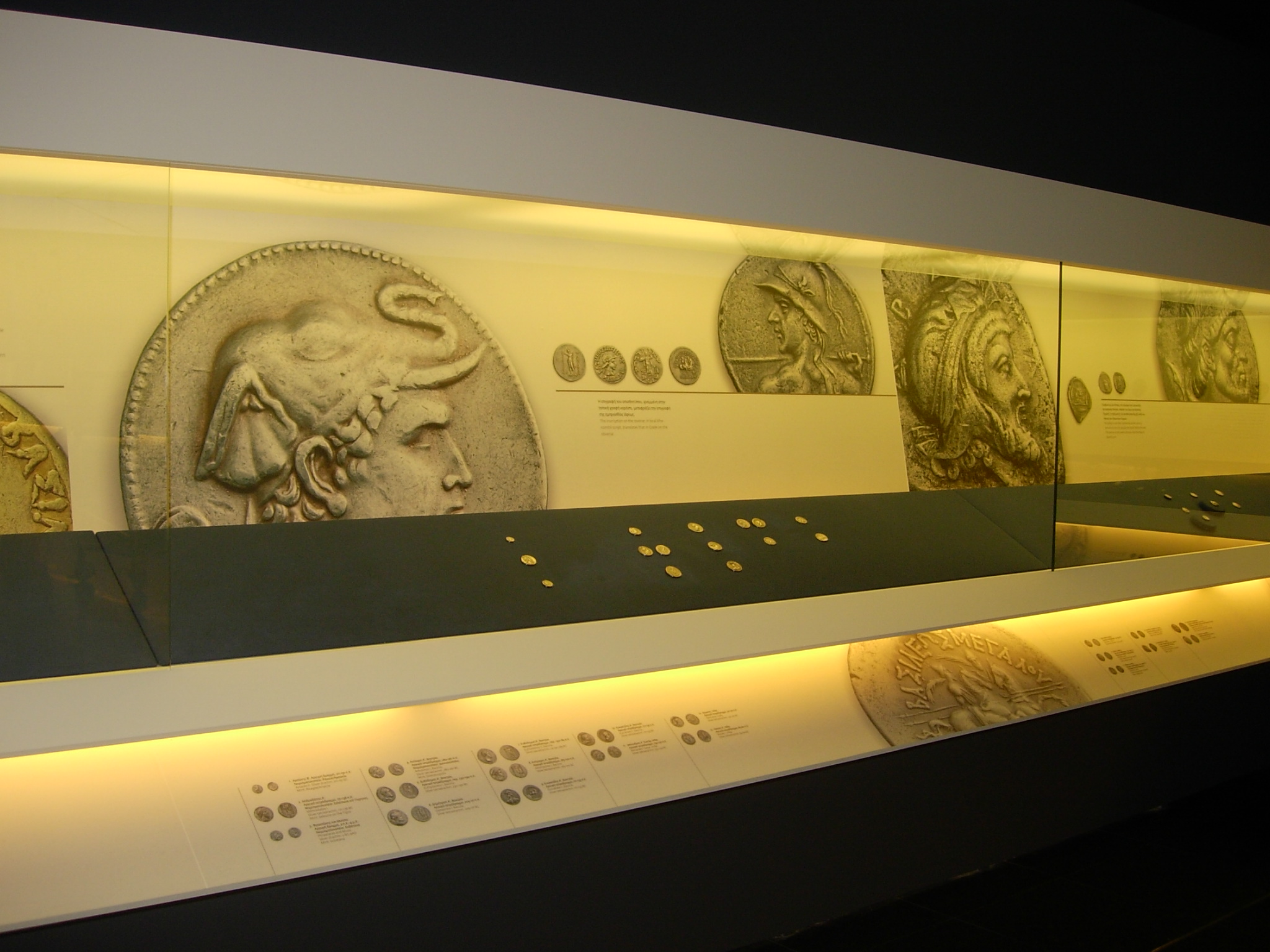 Illuminated case with exhibits about Alexander the Great. “Hellenic Coinage. The Alpha Bank Collection”, Alexander the Great