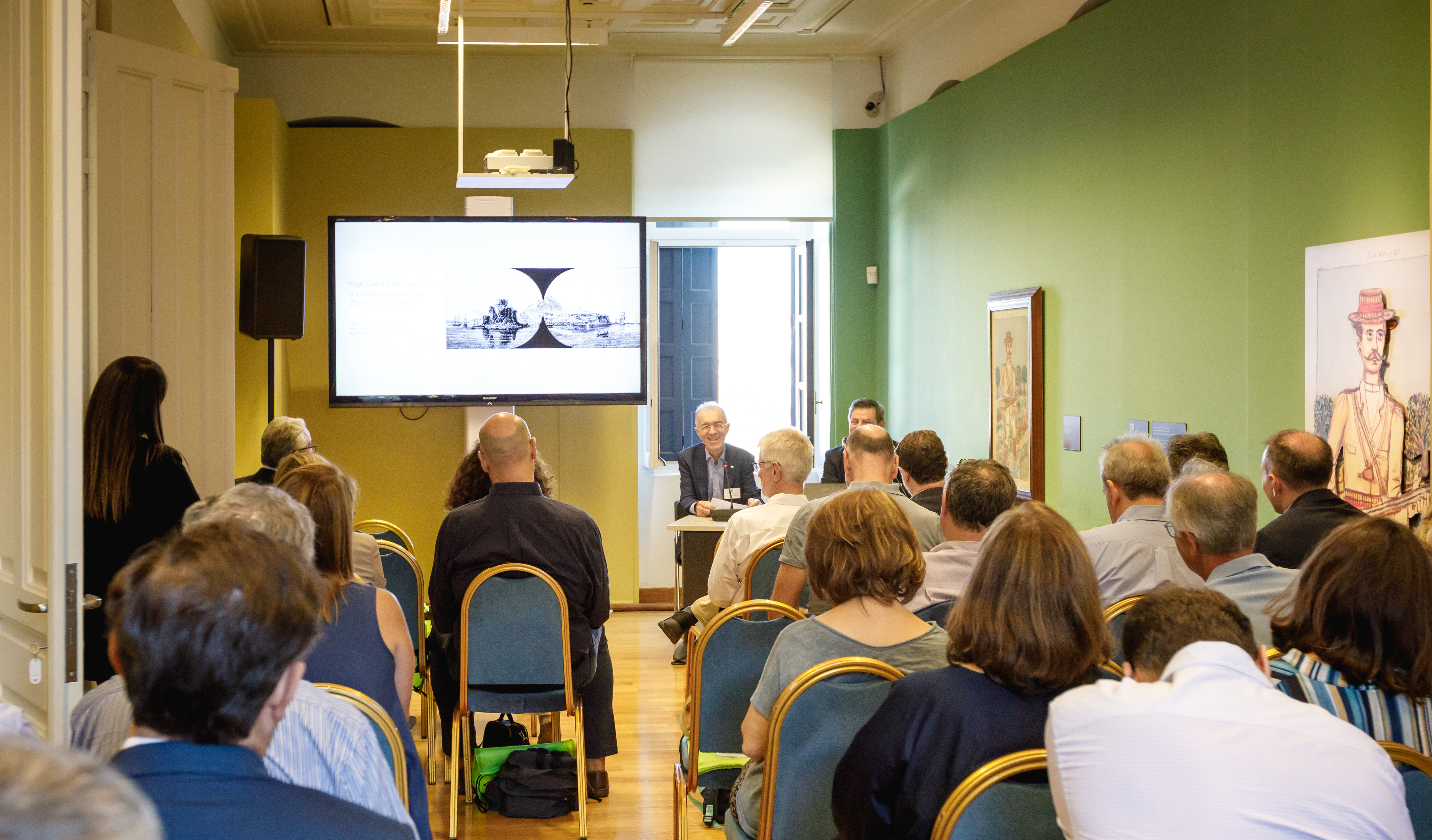 Speakers and audience, with video-projection, at the Alpha Bank Cultural Centre in Nafplio.  Academic Meeting of the Historical Archives of 2 Banks