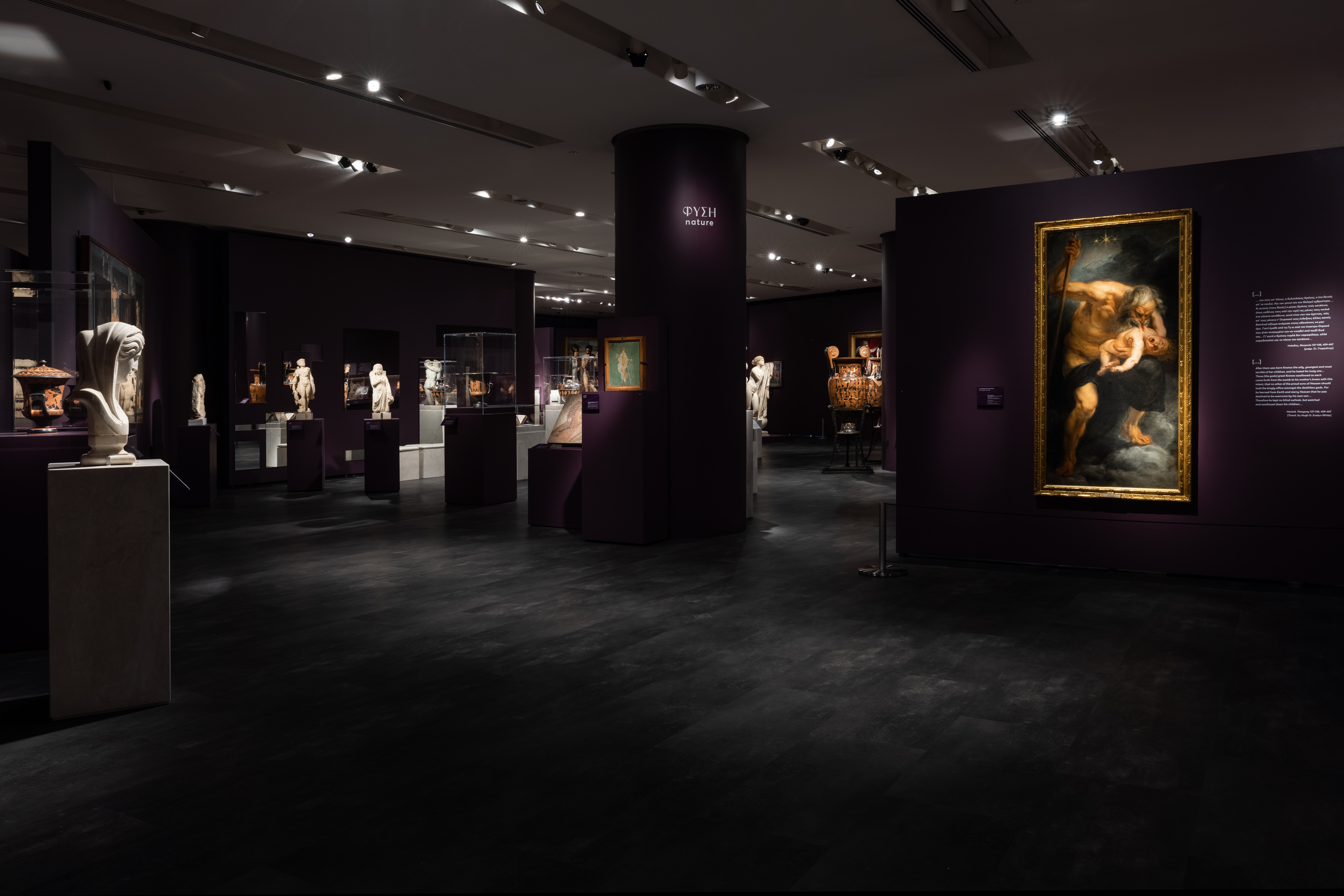 Paintings, sculptures, statues and vases in the dim-lit exhibition hall. The exhibition hall