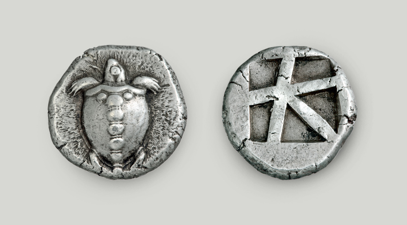 Two sides of the Aegina silver stater. On the obverse sea turtle, on the reverse incuse square split in 5 sections.  Two sides of Aegina silver stater